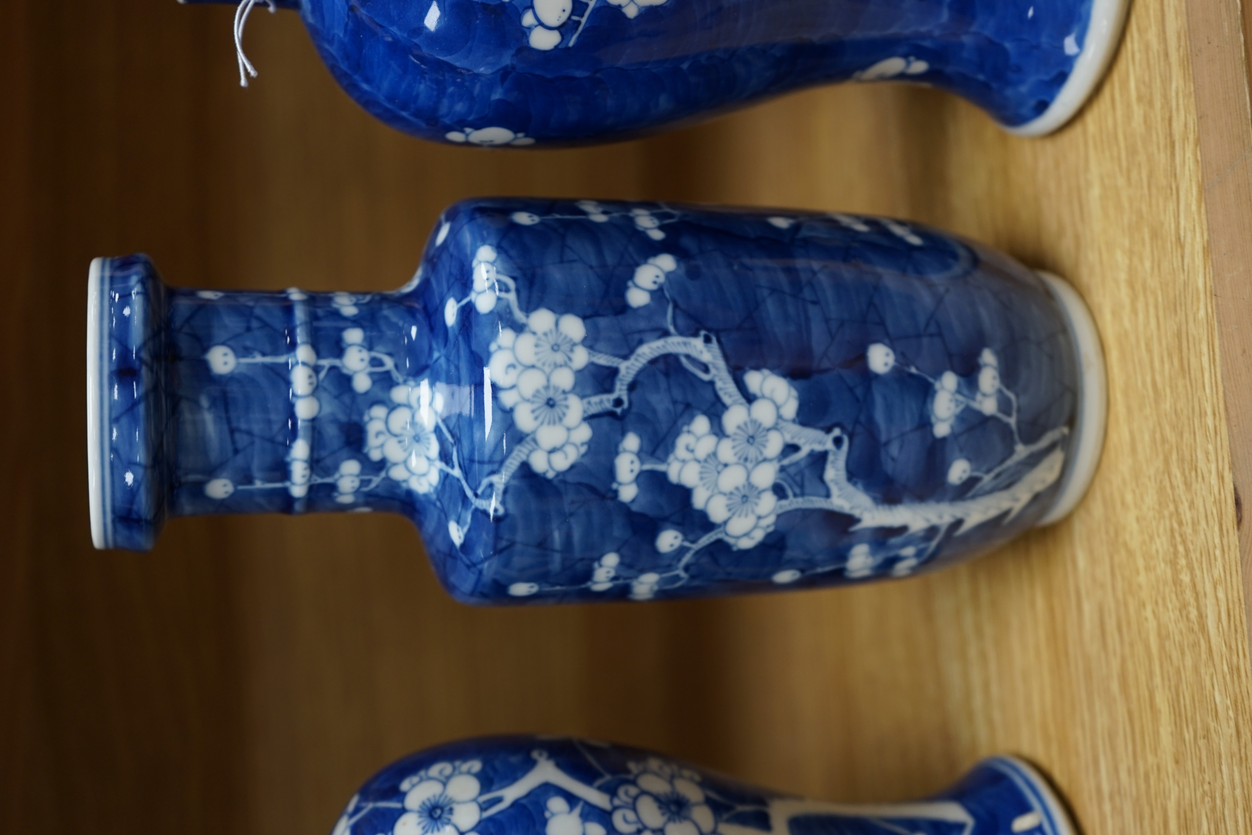 Three Chinese blue and white prunus vases. 25.5cm